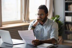 man reviewing paperwork