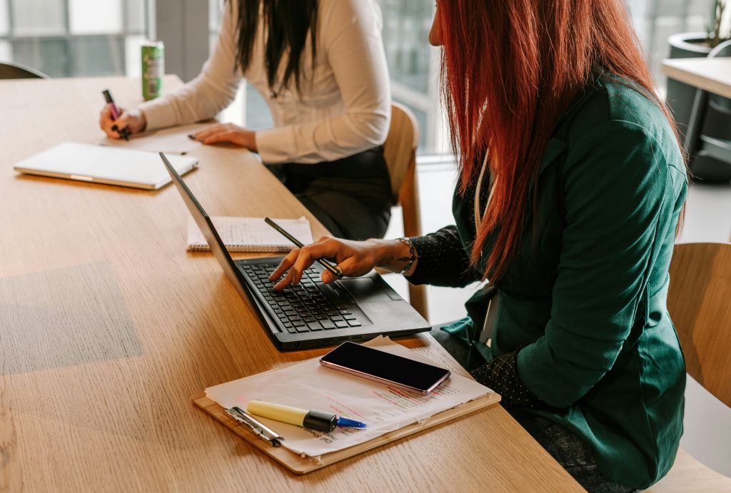Employees typing and writing